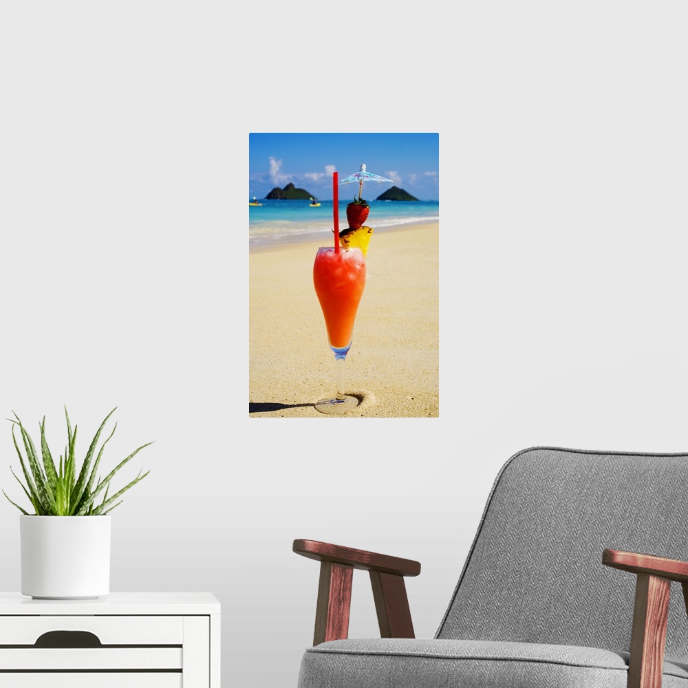 A modern room featuring A tropical cocktail on the beach, Mokulua Islands and kayakers in background.