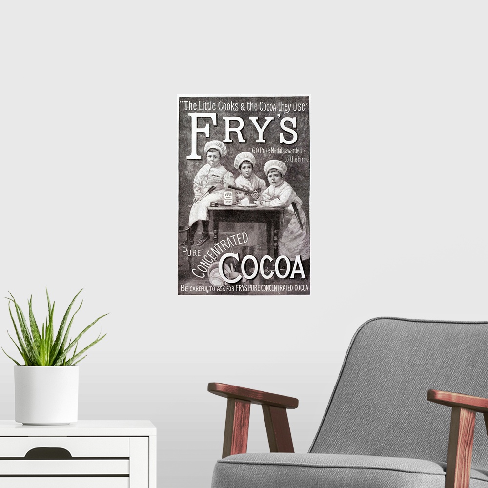 A modern room featuring Advertisement for Fry's Cocoa. Shows children in chef's clothing round a kitchen table.