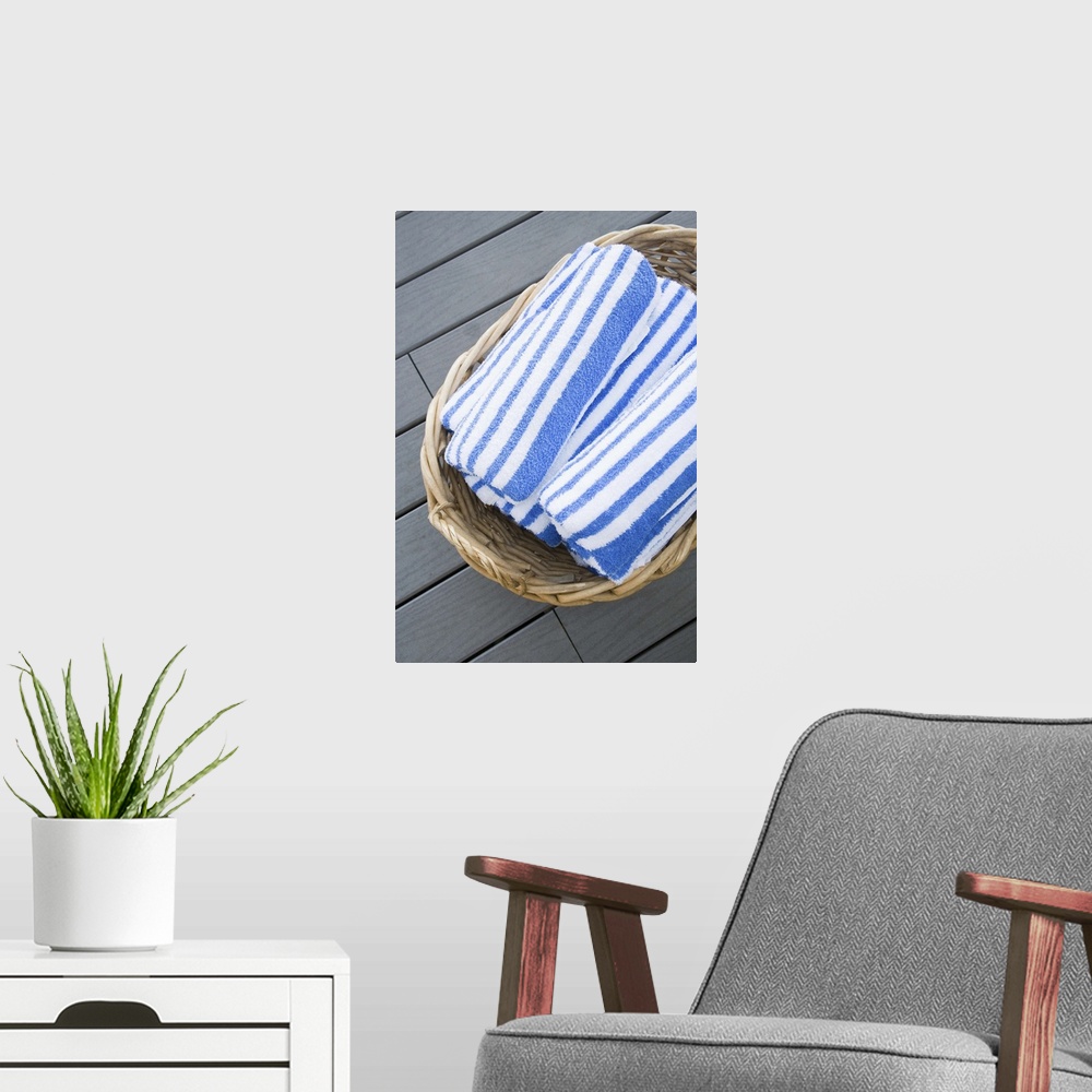 A modern room featuring Beach towels in basket