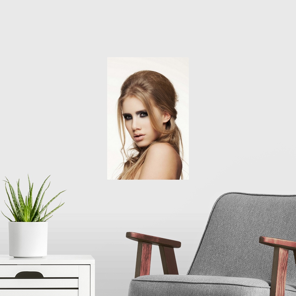 A modern room featuring Close-up of young female face, beauty portrait, clear skin, professional make-up.
