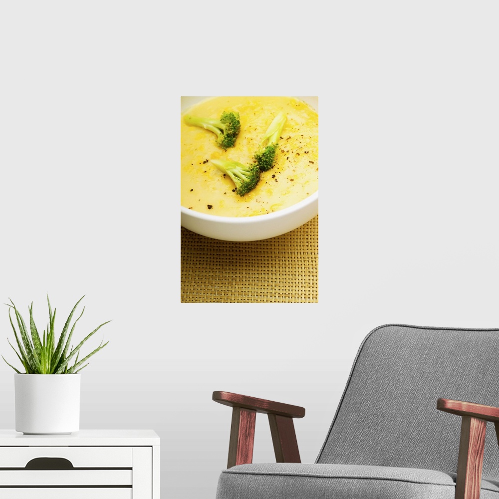 A modern room featuring Bowl of broccoli soup, close-up