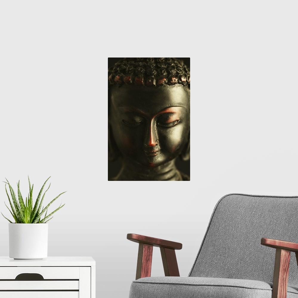 A modern room featuring Close-up of a statue of Buddha