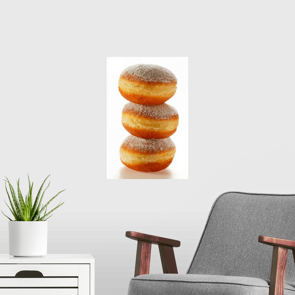 A modern room featuring Doughnuts with icing sugar, in a pile