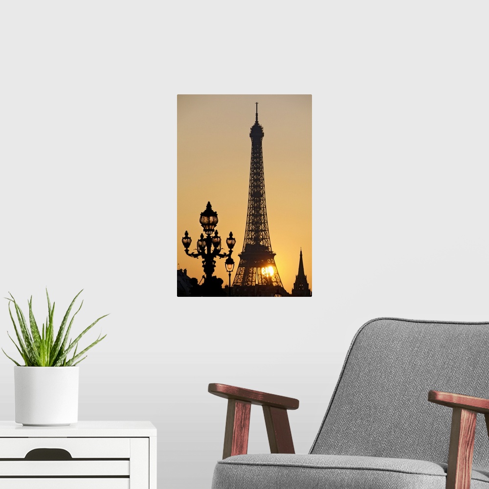 A modern room featuring Eiffel Tower at sunset
