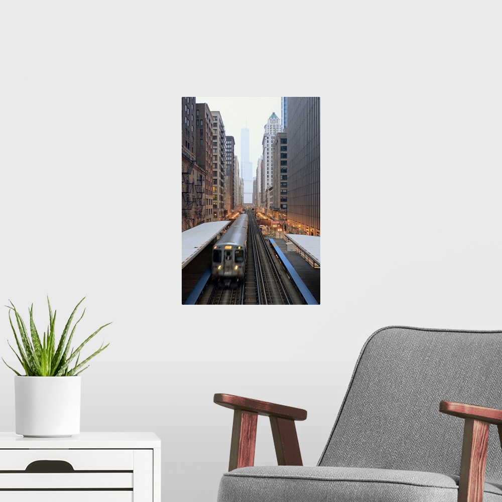 A modern room featuring Vertical panoramic photograph of railway lined with tall buildings and skyscrapers.
