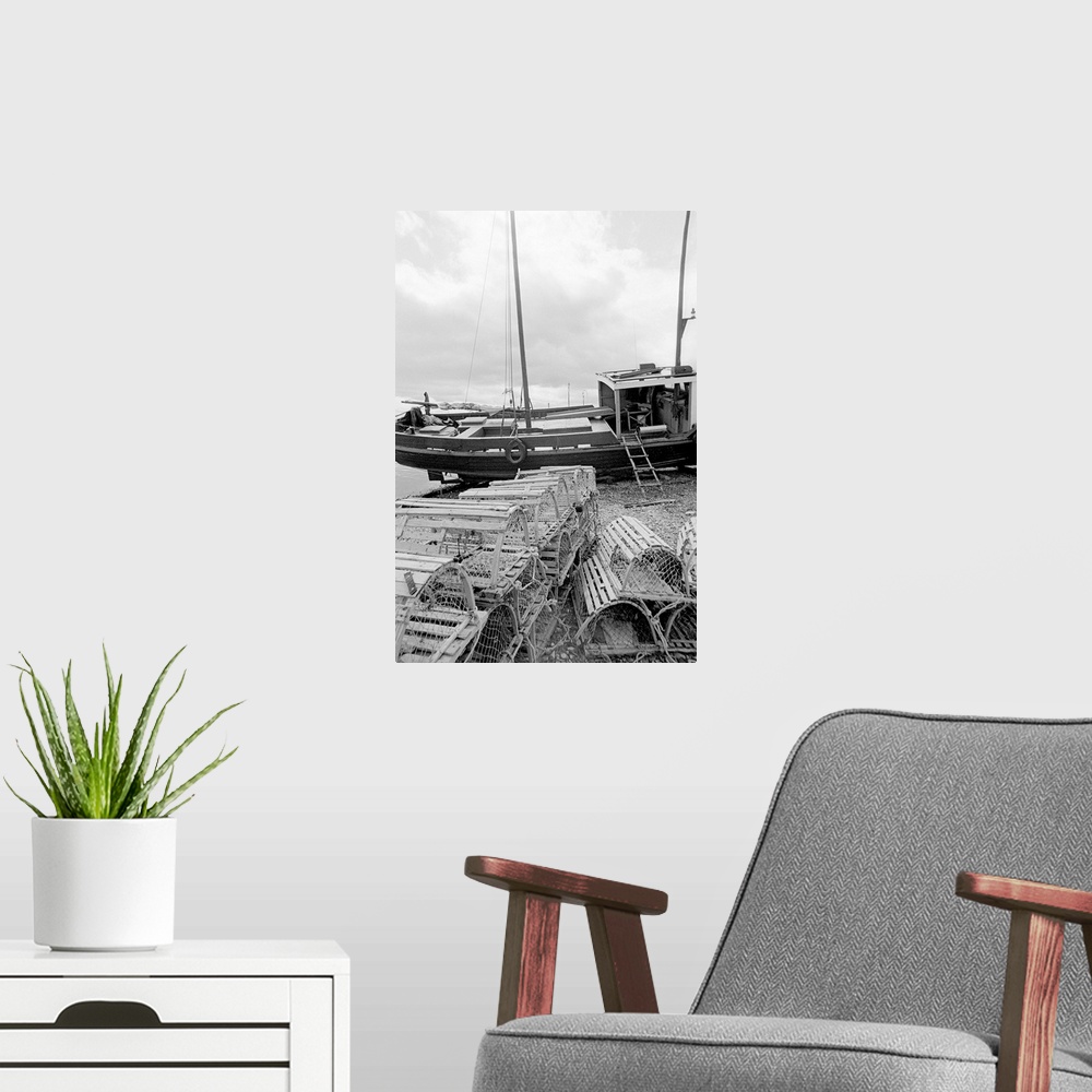 A modern room featuring black and white image of fishing vessel and lobster traps