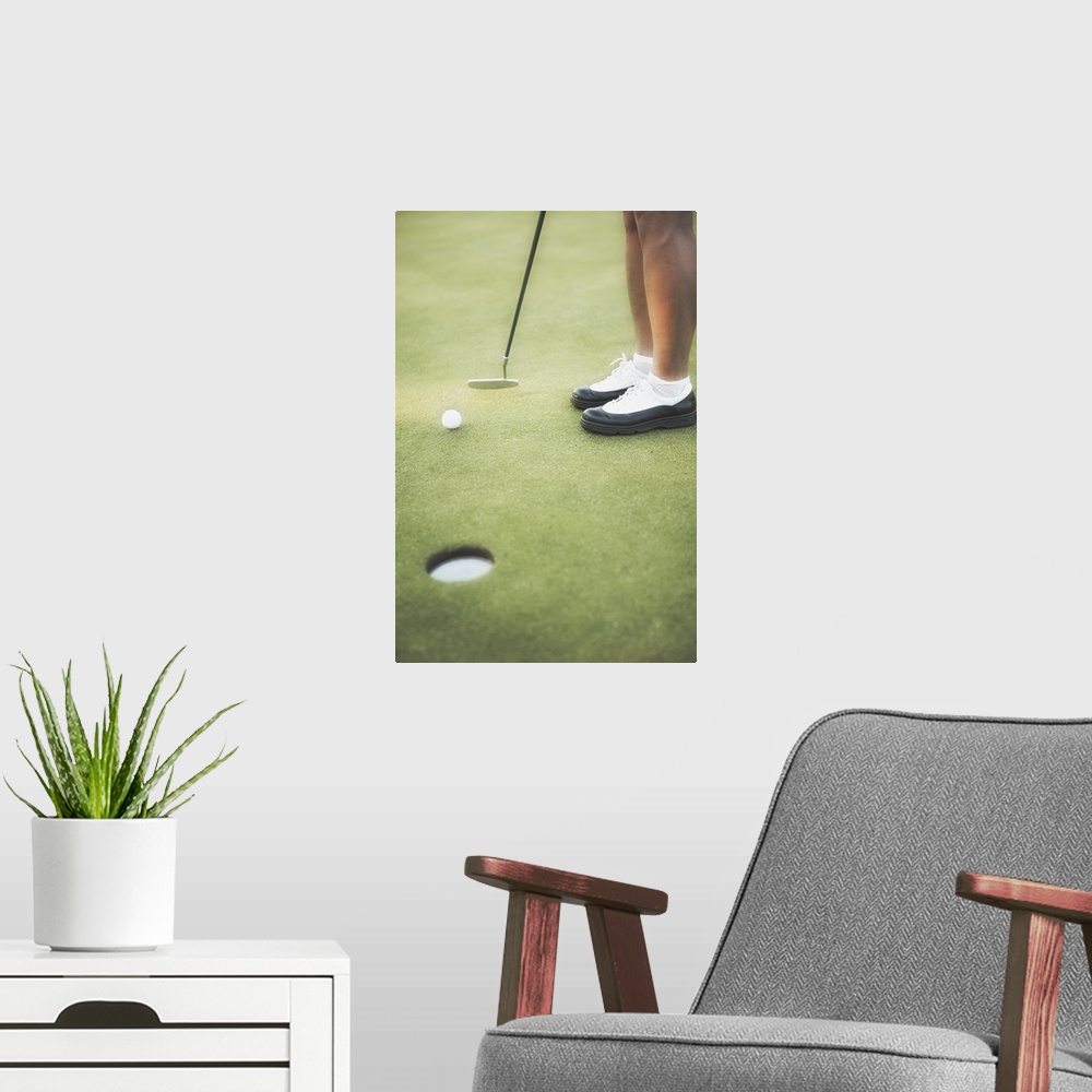 A modern room featuring Golfer putting