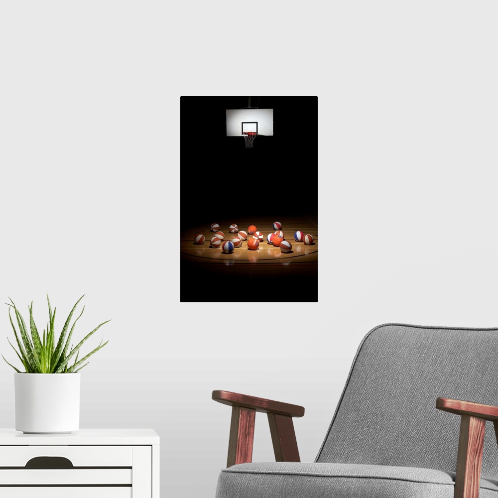 A modern room featuring Many basketballs resting on the floor