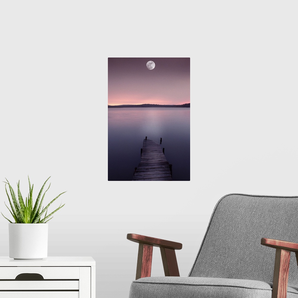 A modern room featuring Moon over lake with pier at dusk