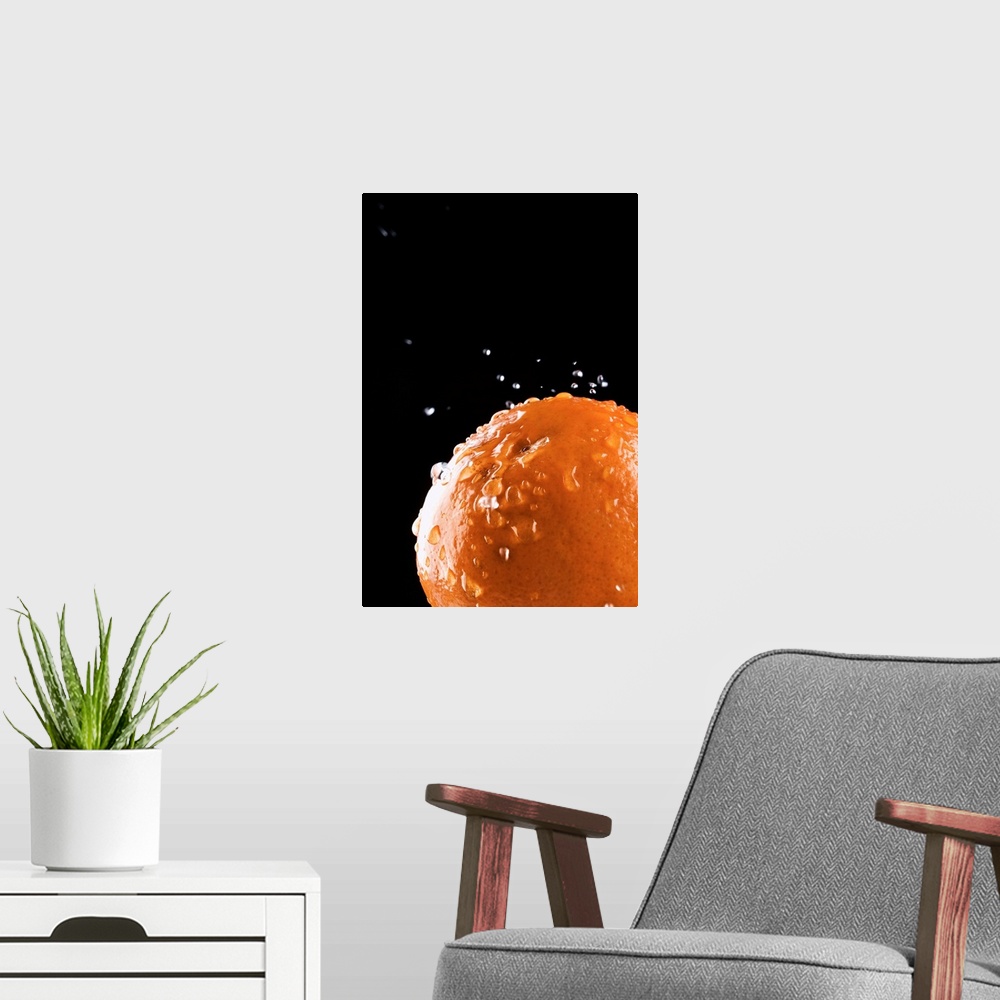 A modern room featuring Orange with water droplets splashing