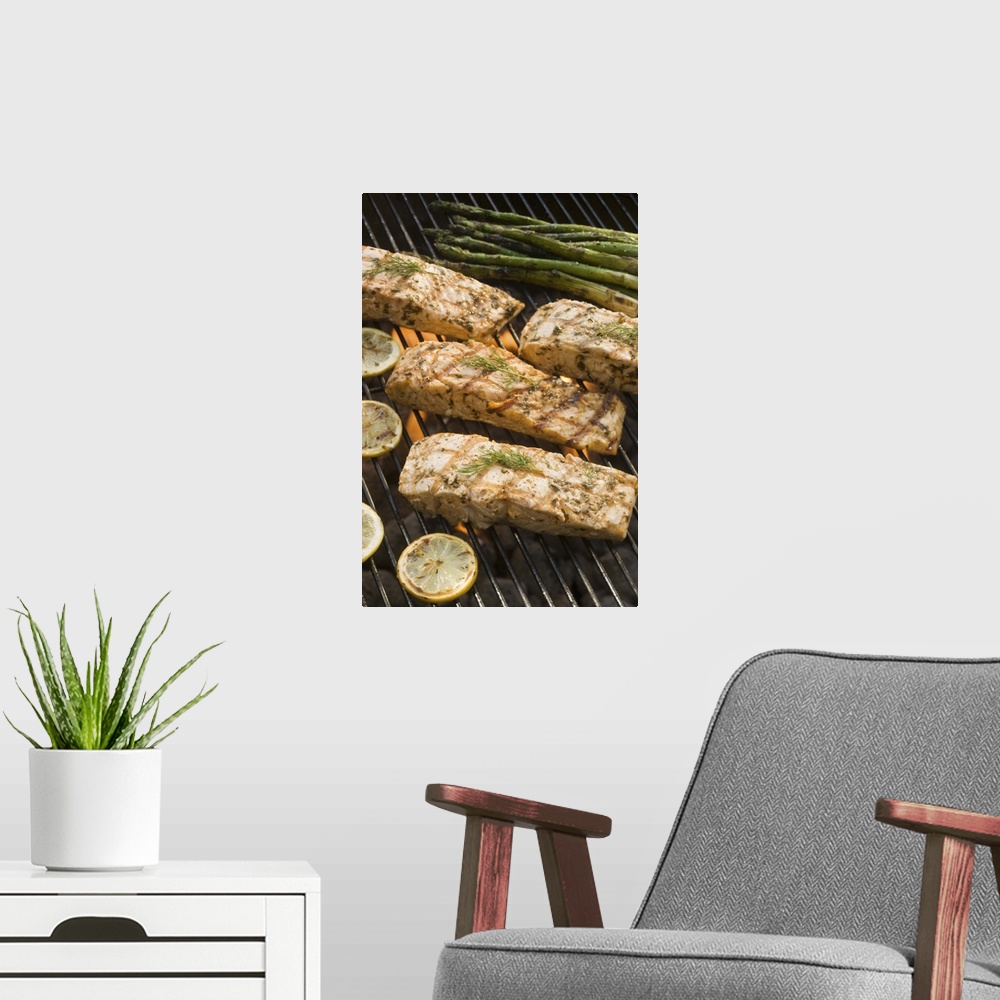 A modern room featuring Fish and asparagus cooking on grill