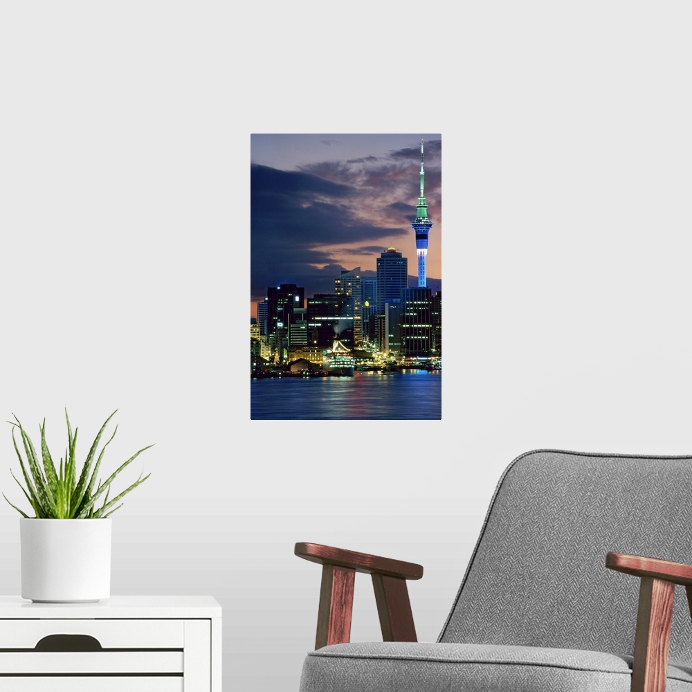 A modern room featuring Sky Tower and cruise ships in Auckland Harbour, North Island, New Zealand