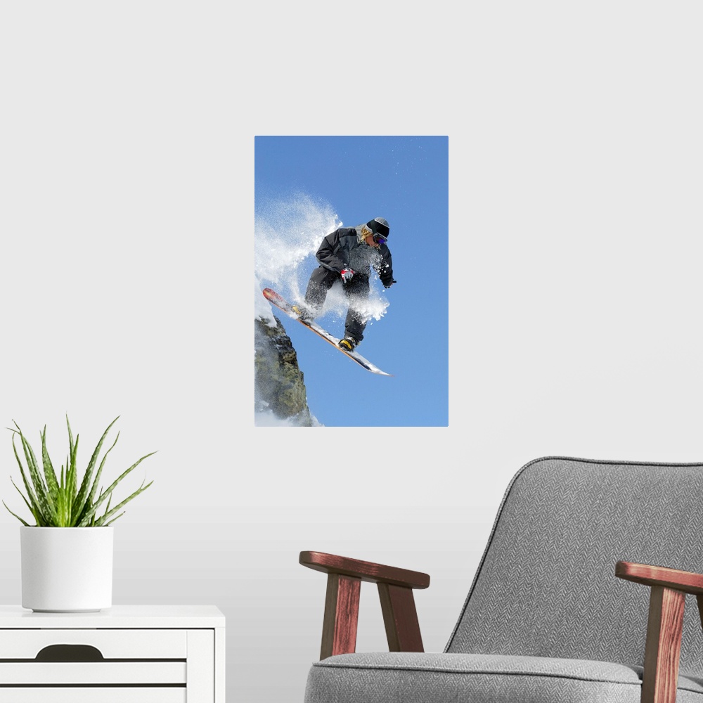 A modern room featuring Snowboarder jumping off ledge