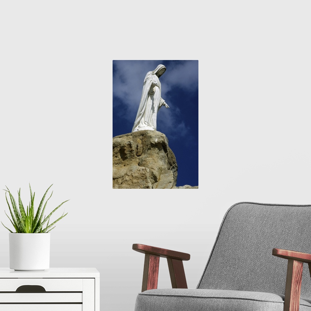 A modern room featuring Statue on a rock, Corsica island, France