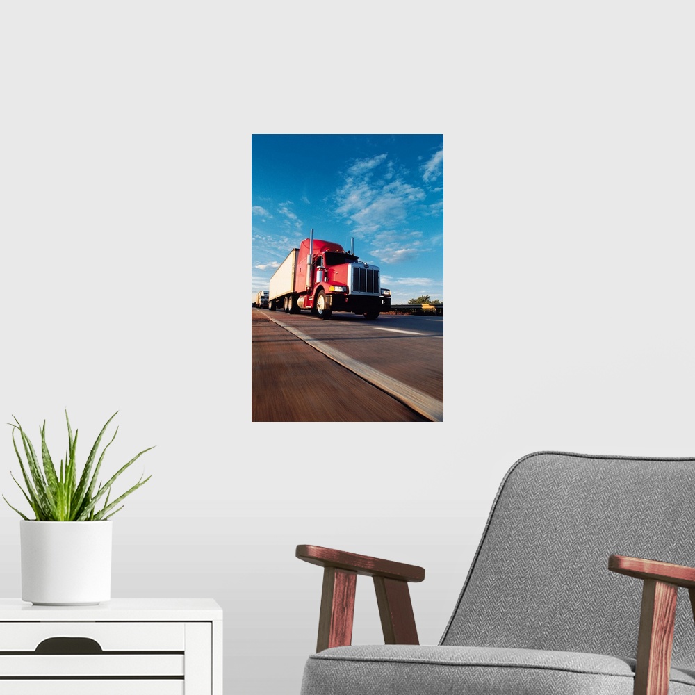 A modern room featuring Truck driving on highway