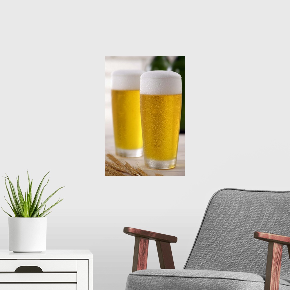 A modern room featuring Two glasses of beer