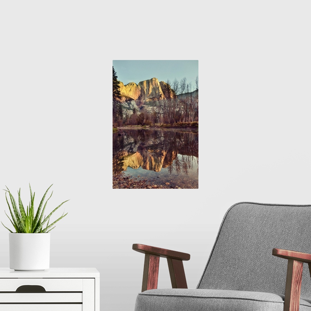 A modern room featuring Upper Yosemite falls at sunrise. Yosemite lodge river bend, reflections.