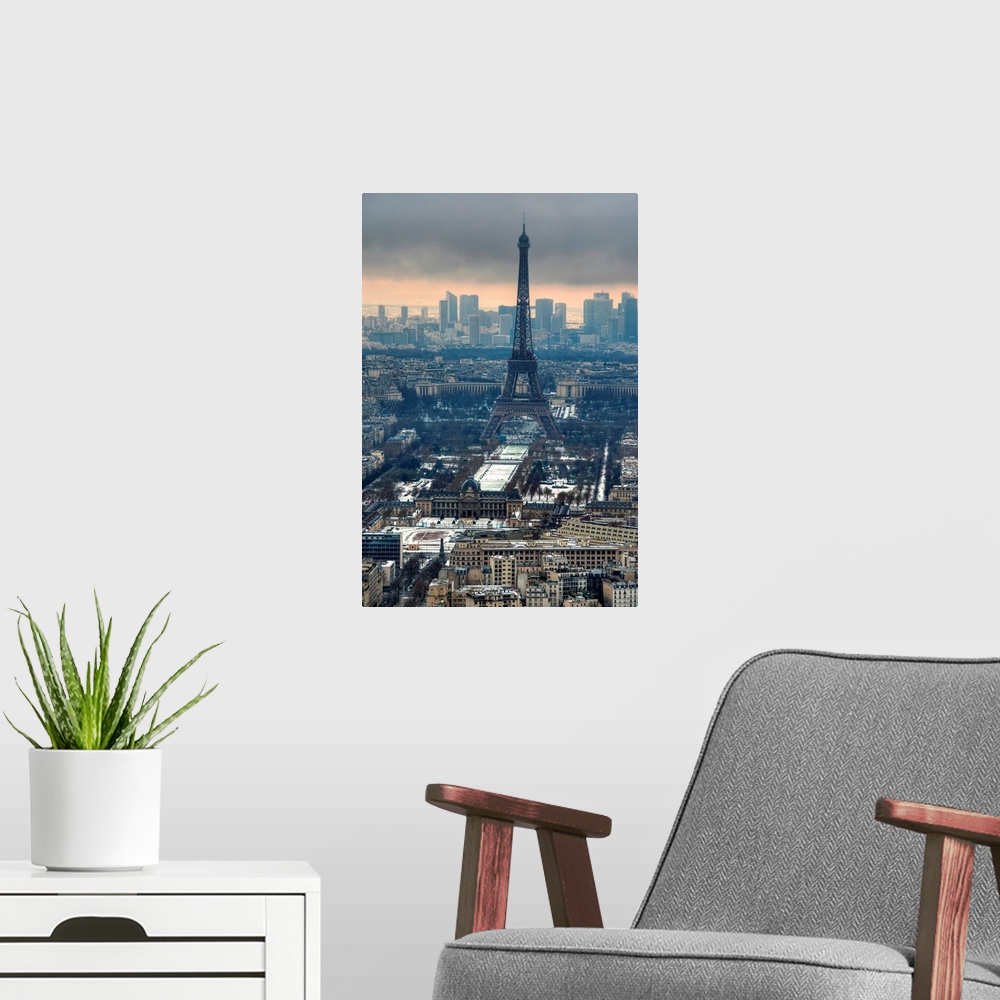 A modern room featuring View of the Eiffel tower taken at sunset in winter. La Defense can be seen in the background.