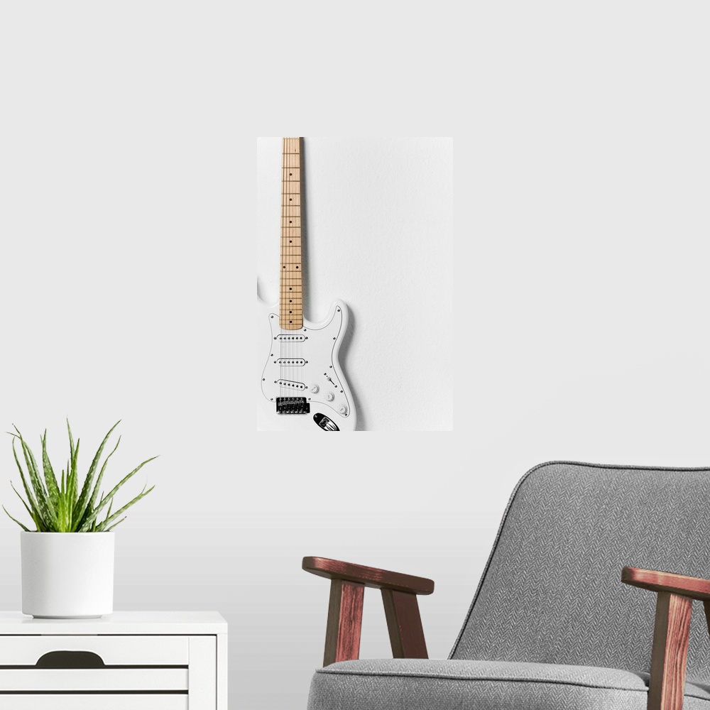 A modern room featuring White electric guitar