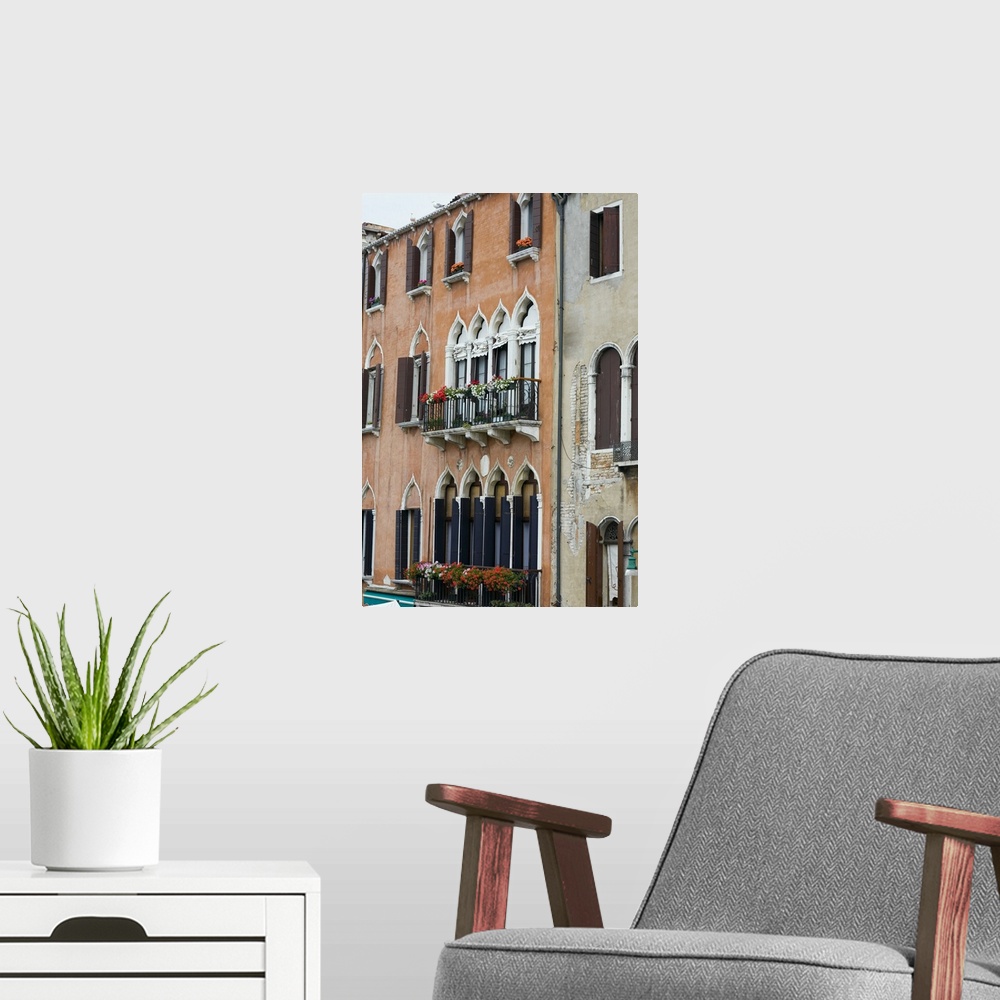 A modern room featuring Window boxes hanging on the railings of windows, Venice, Italy