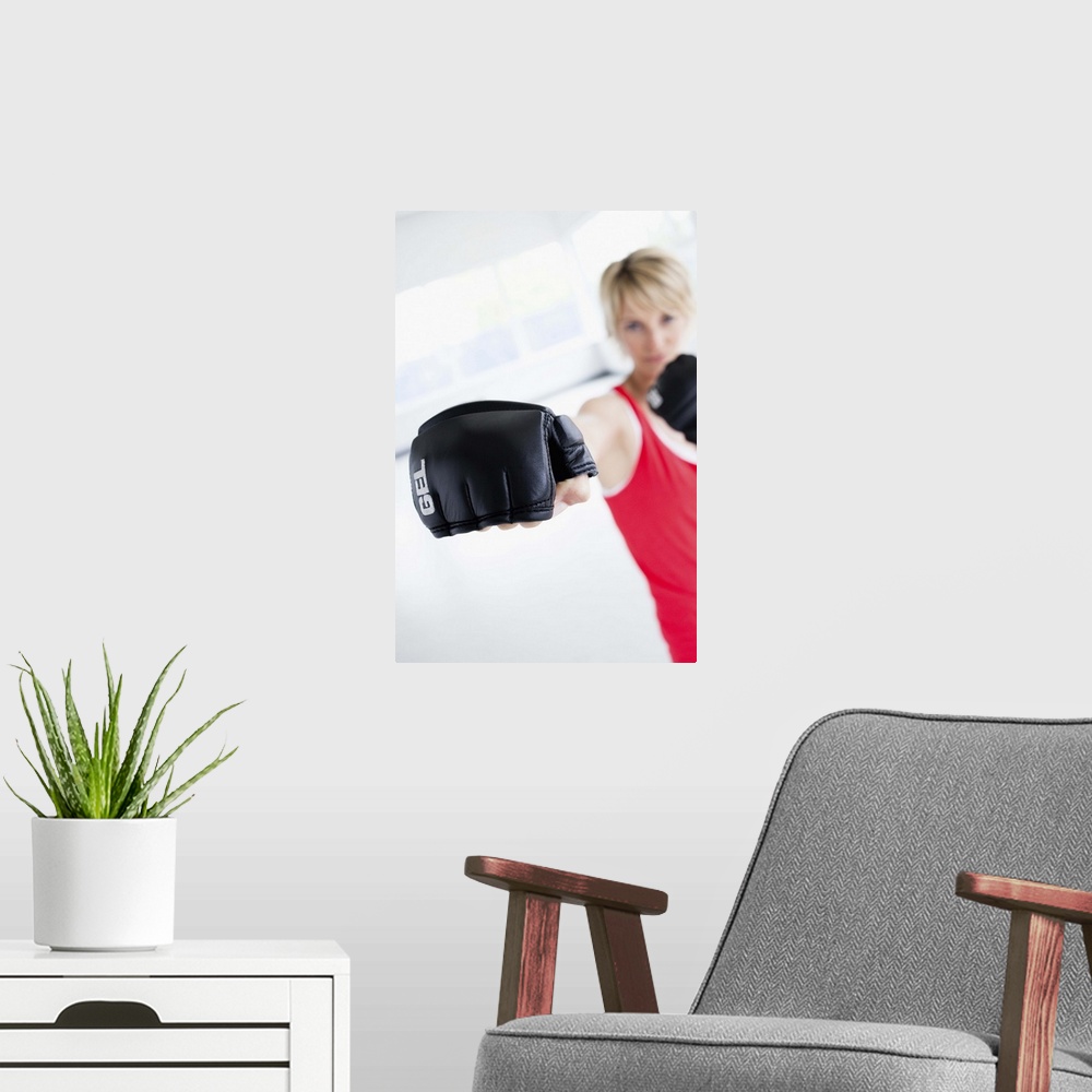 A modern room featuring Woman kickboxing