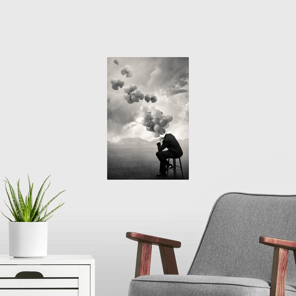 A modern room featuring An abstract art photograph of a hollow business suit seated on a stool, with balloons hovering ou...