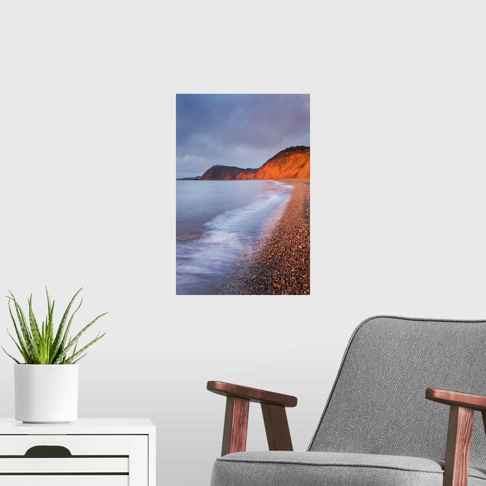 A modern room featuring Burning red cliffs at Sidmouth on the Jurassic Coast, Devon, England. Winter