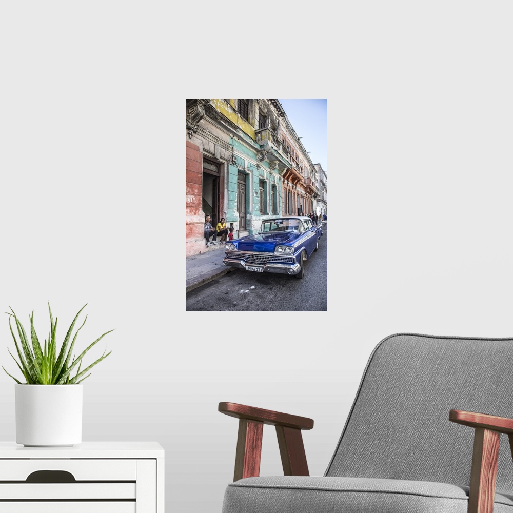 A modern room featuring Classic 50s america car in the streets of Centro Habana, Havana, Cuba.