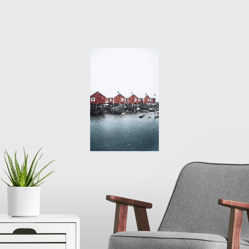 A modern room featuring Hamnoy village with snowflakes, Reine Bay, Lofoten Islands, Nordland, Norway.