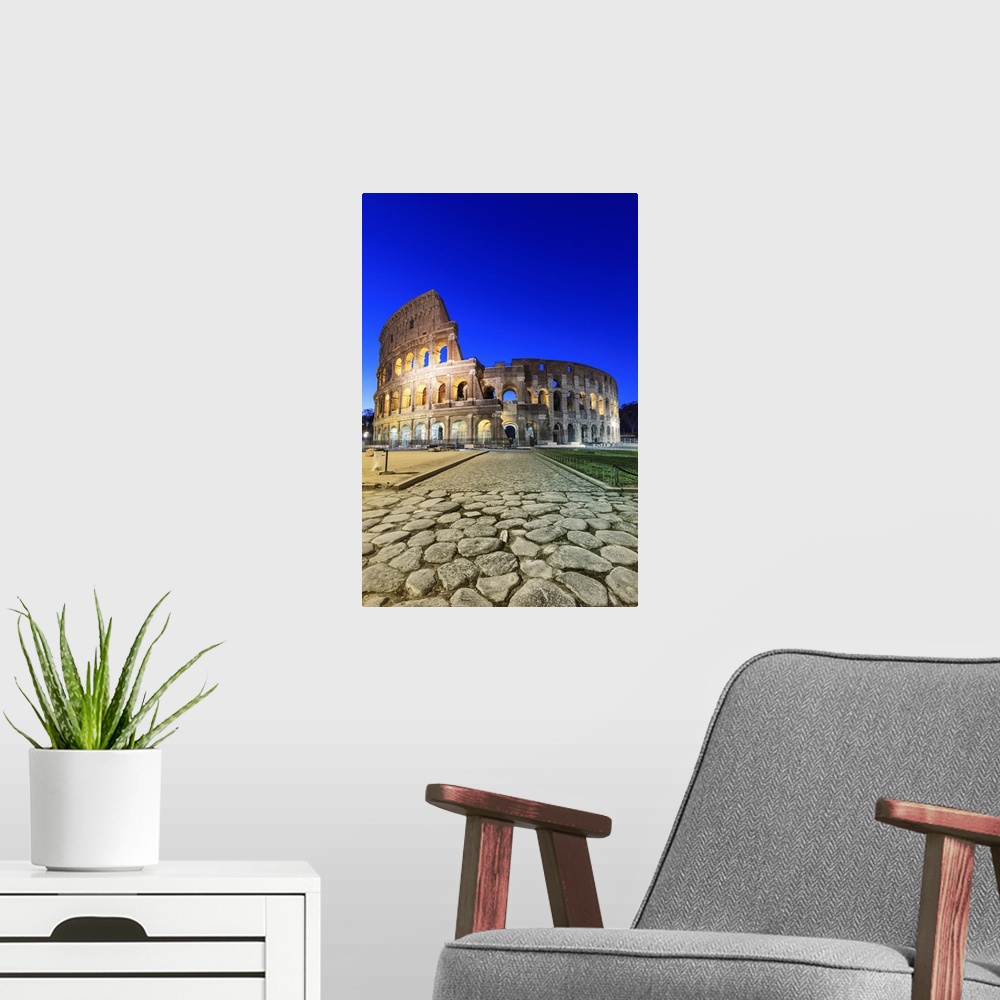 A modern room featuring Italy, Rome, Colosseum and Roman Forum by night