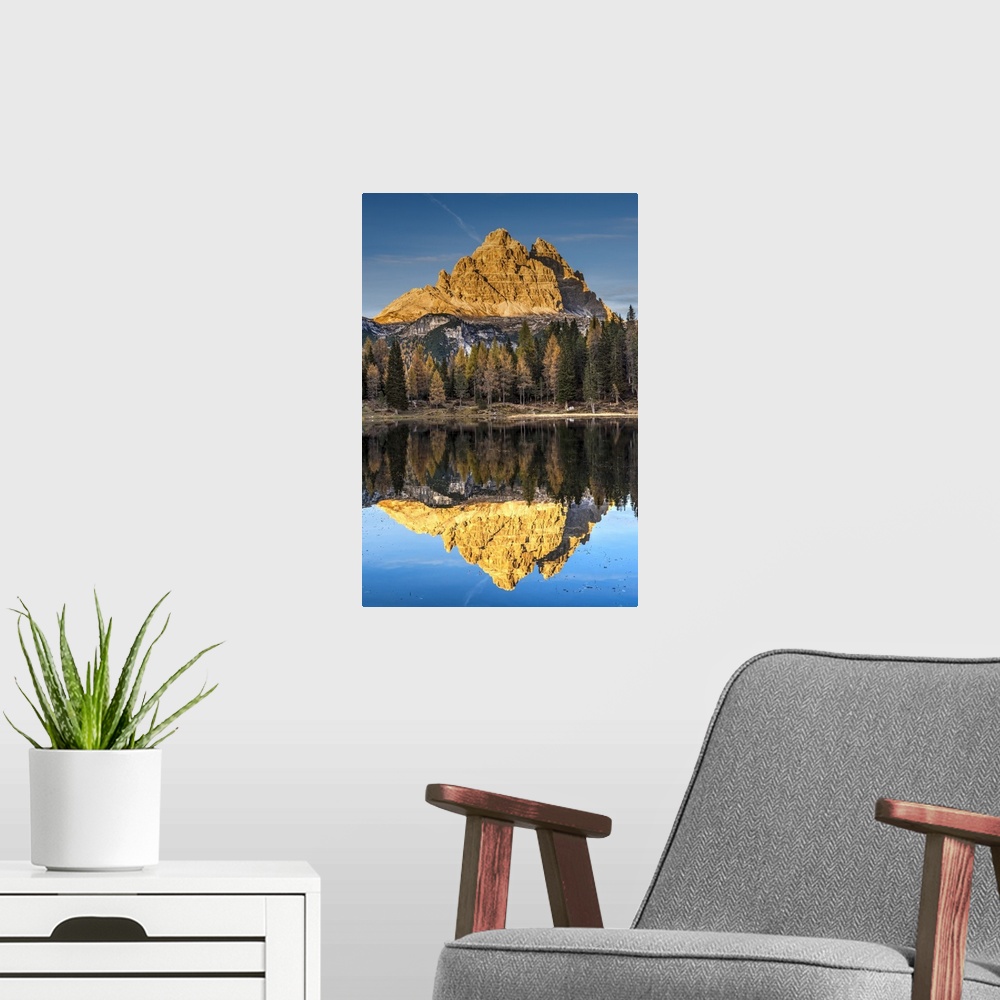 A modern room featuring Lake d'Antorno with Tre Cime di Lavaredo mountain group reflected in its waters, Misurina, Veneto...