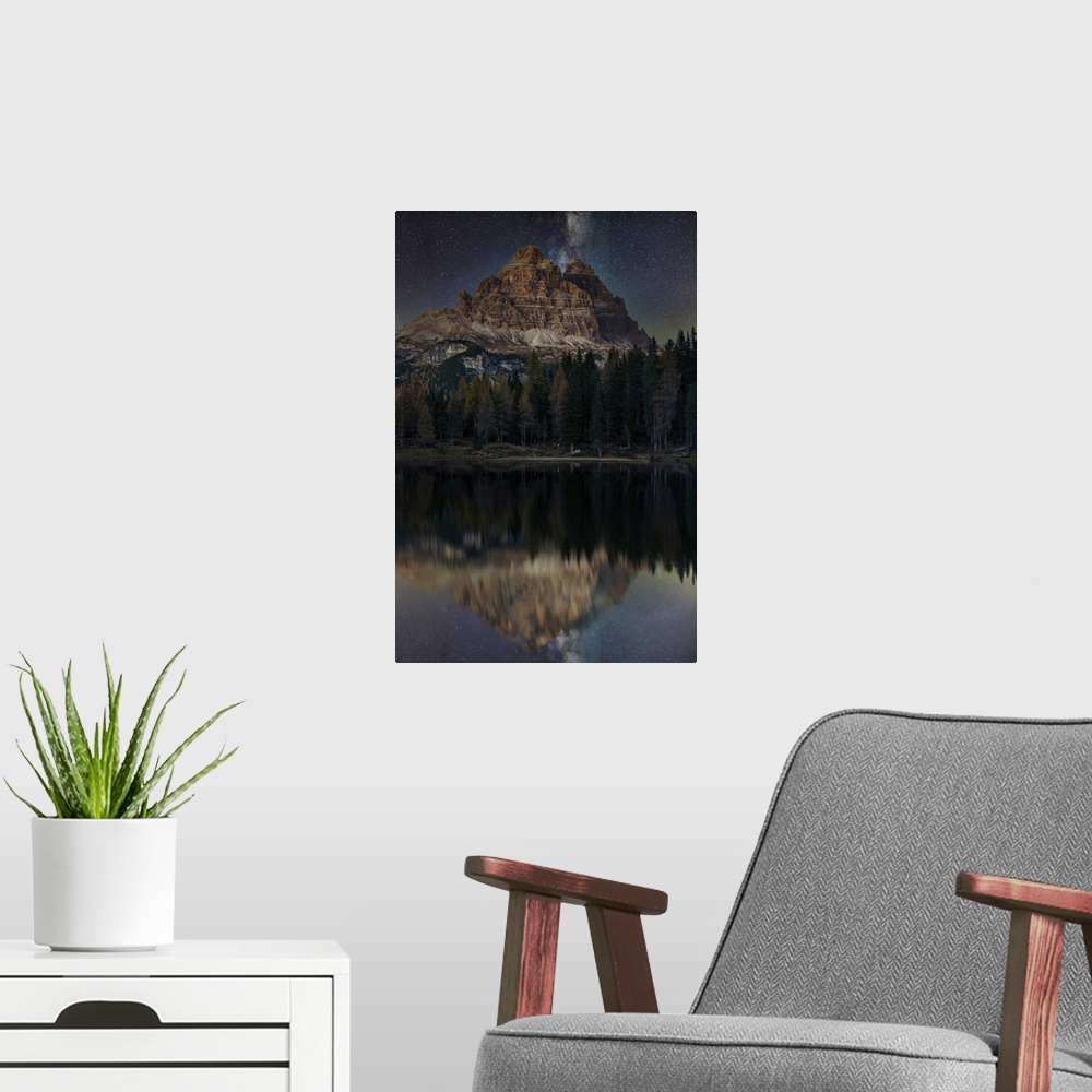 A modern room featuring Lake d'Antorno with Tre Cime di Lavaredo mountain group under a starry night, Misurina, Veneto, I...