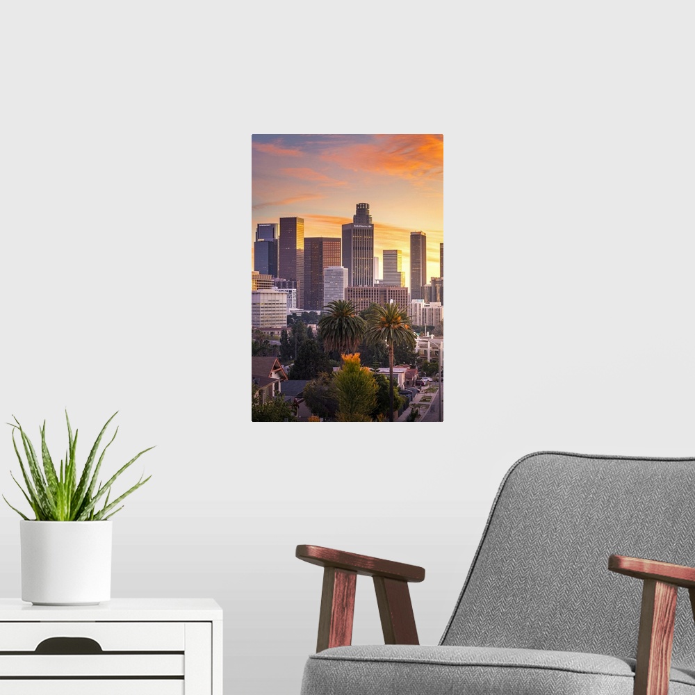 A modern room featuring Los Angeles Downtown at sunset as seen from Figueroa district. Los Angeles, California, USA