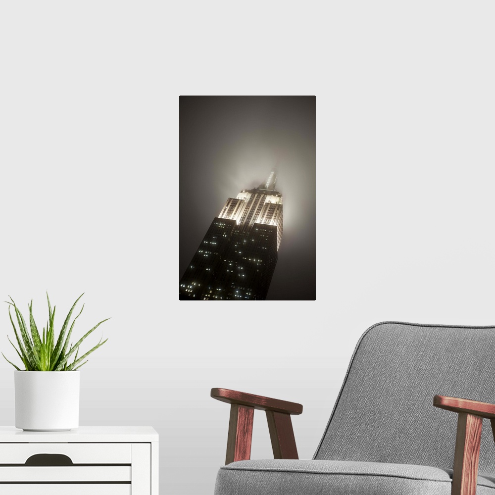 A modern room featuring USA, New York City, Manhattan, Empire State Building on a rainy evening- low angle view