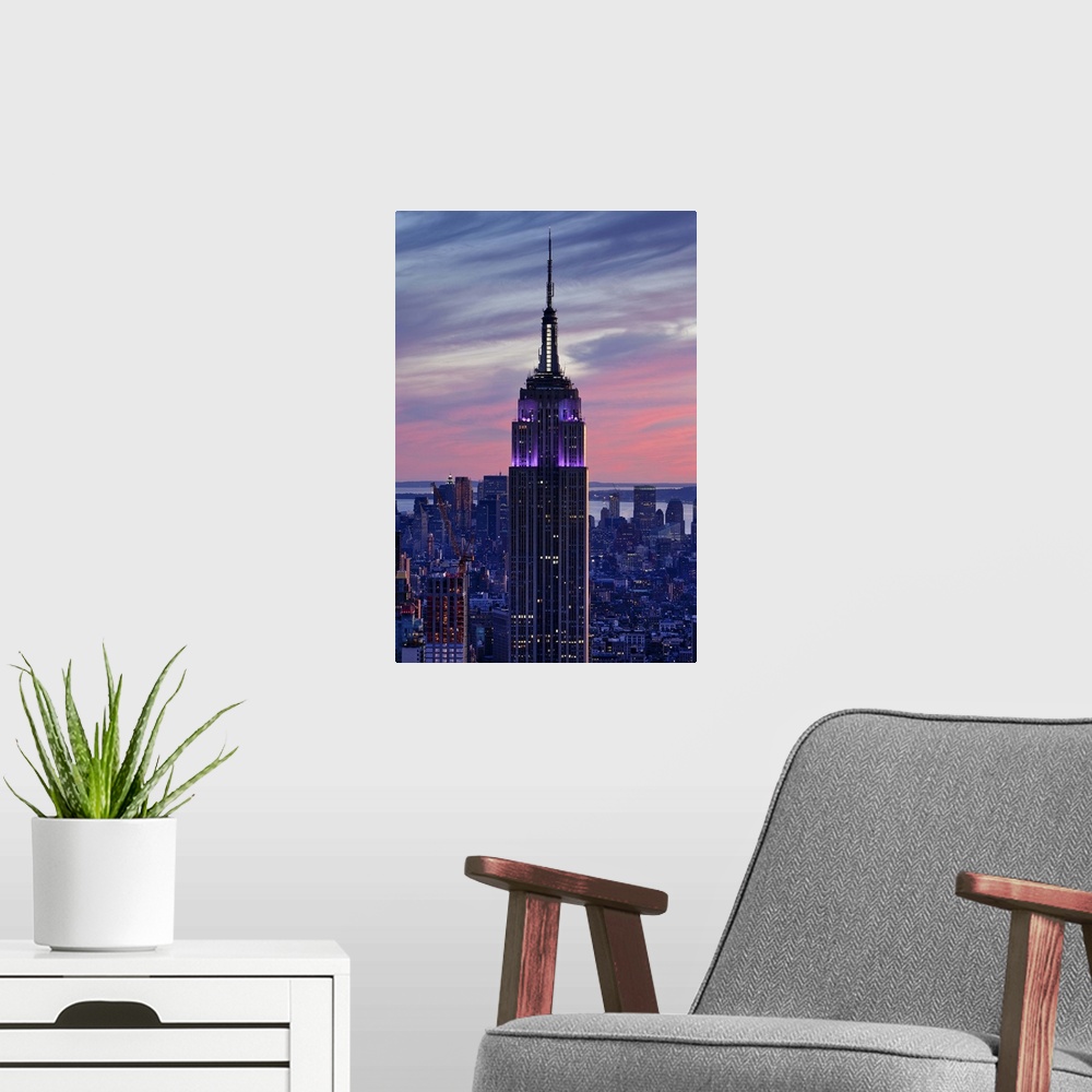 A modern room featuring USA, New York City, Manhattan,  View towards Downtown Manhattan and the Empire State building fro...