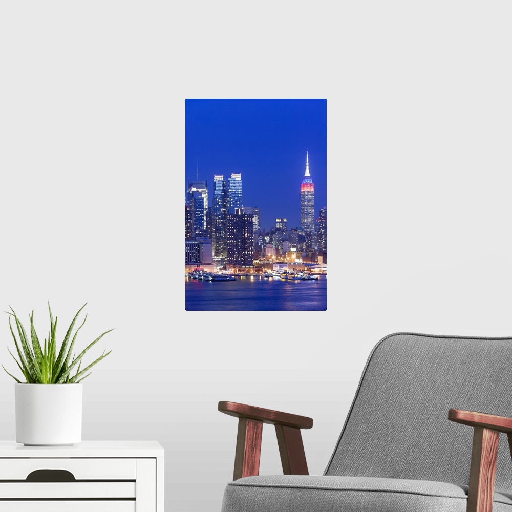 A modern room featuring USA, New York, New York City, elevated view of midtown Manhattan fand Empire State Building from ...