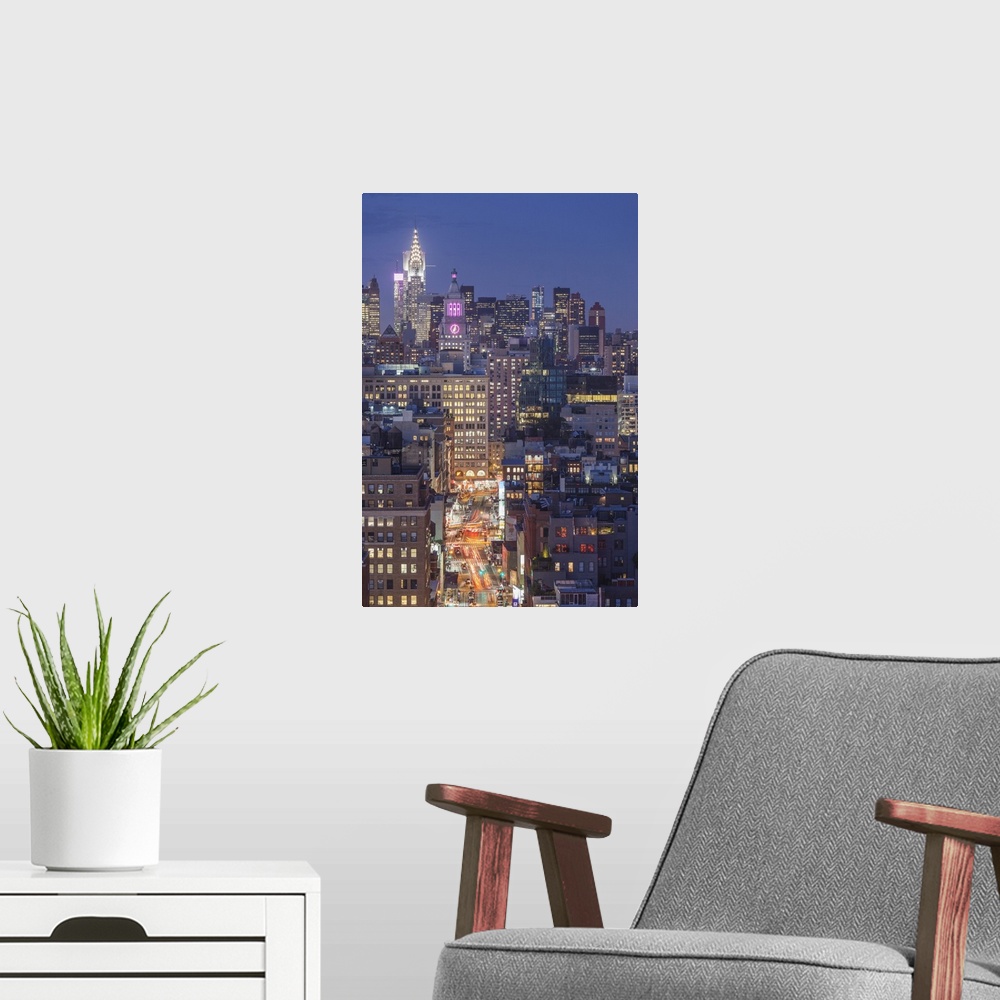 A modern room featuring USA, New York, New York City, Lower Manhattan, elevated view of SoHo, dusk