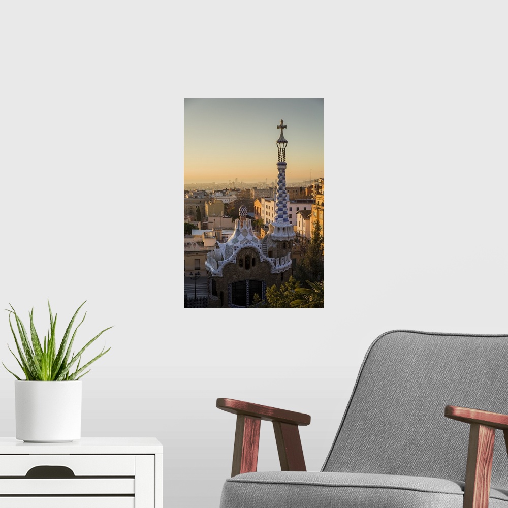 A modern room featuring Park Guell with city skyline behind at sunrise, Barcelona, Catalonia, Spain.