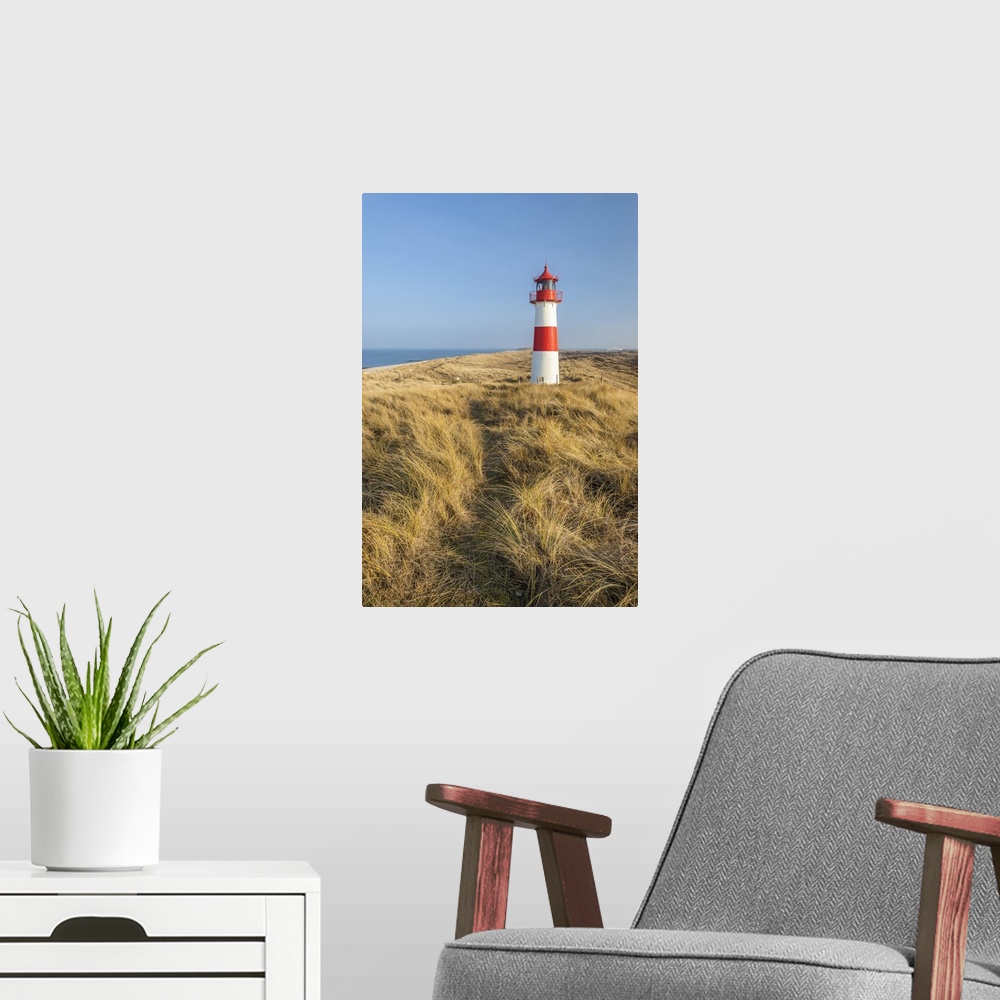 A modern room featuring Path on the dune to the List-Ost lighthouse on the Ellenbogen Peninsula, Sylt, Schleswig-Holstein...