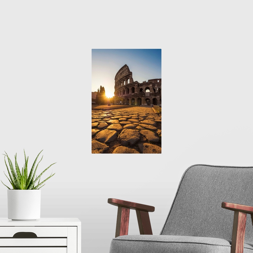 A modern room featuring Rome, Lazio, Italy. Colosseum at summer sunrise.