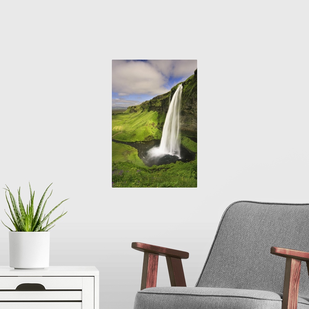 A modern room featuring Seljalandfoss Waterfall, South Coast, Iceland