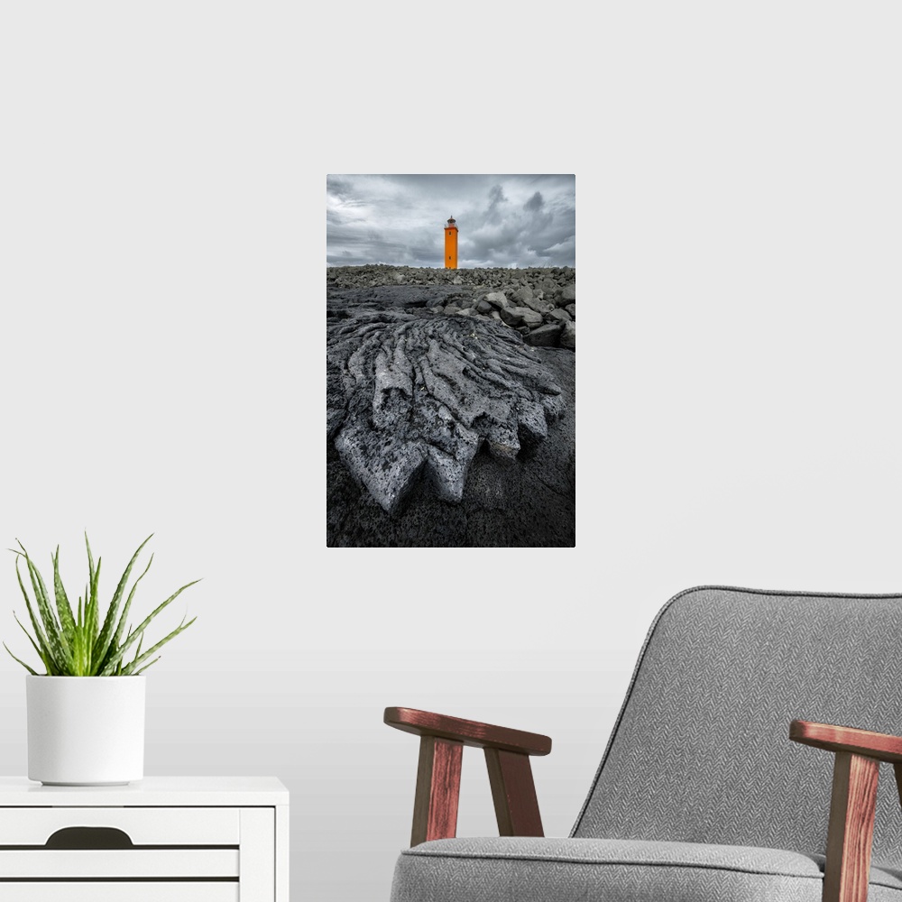 A modern room featuring Selvogsviti Lighthouse and ancient lava flow, Strandakirkja, Iceland