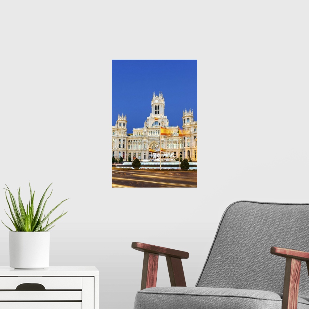 A modern room featuring Spain, Madrid. Plaza de Cibeles with famous fountain and town hall building behind