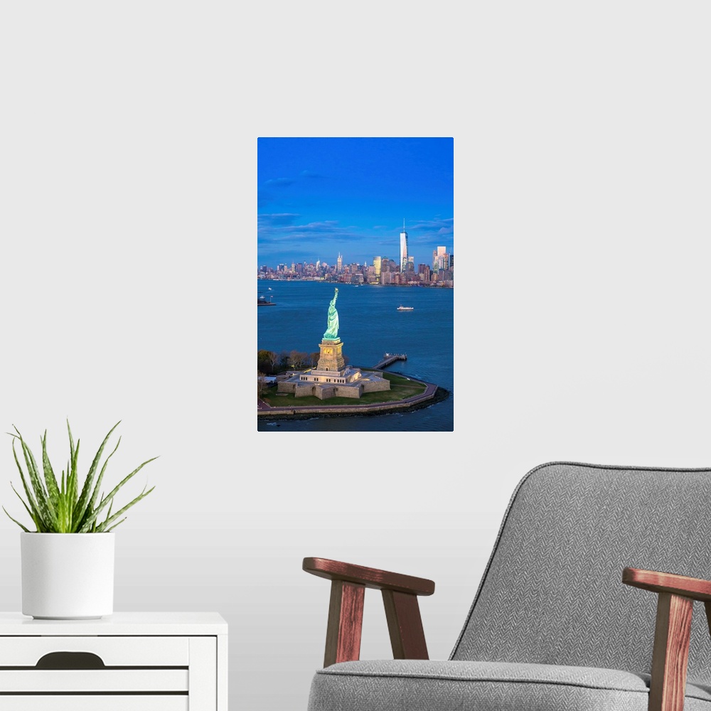 A modern room featuring Statue of Liberty and Lower Manhattan, New York City, New York, USA.