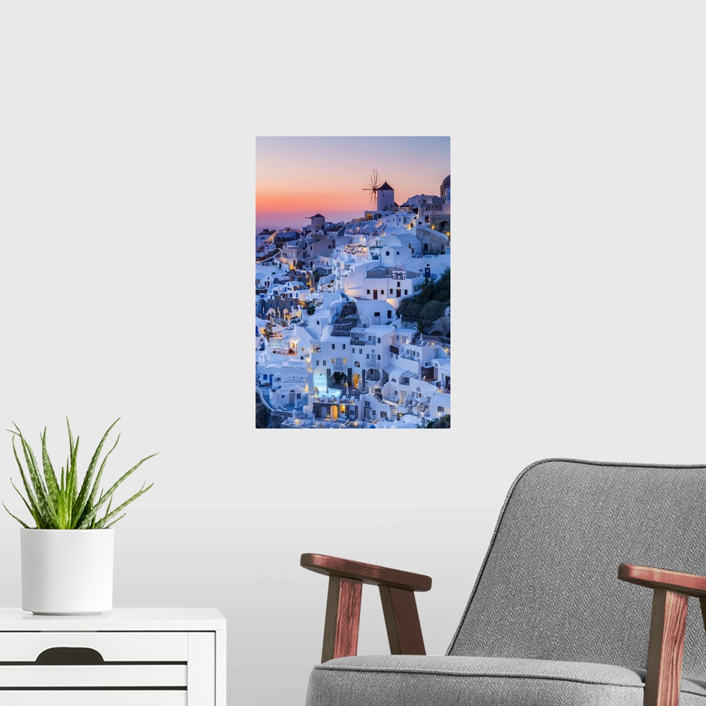 A modern room featuring Sunset at the village of Oia in Santorini, Cyclades Islands, Greece.