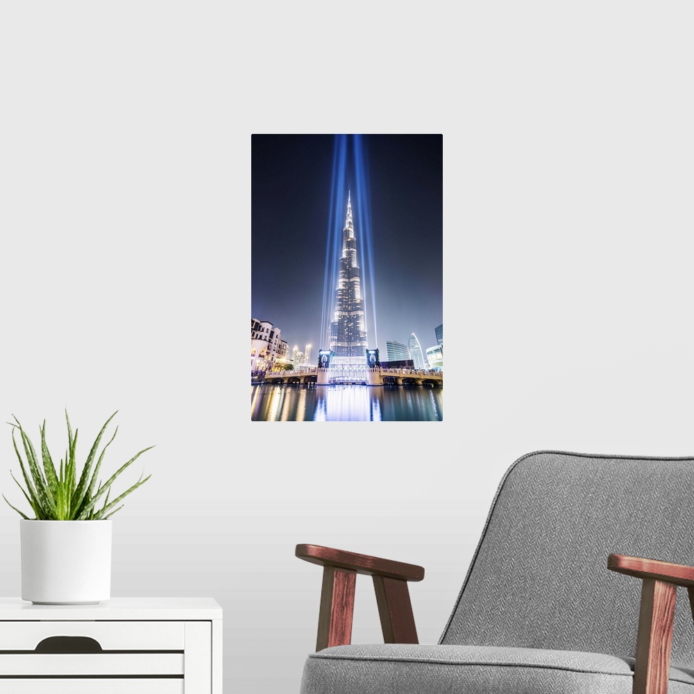 A modern room featuring United Arab Emirates, Dubai. Burj Khalifa at dusk, with light show
