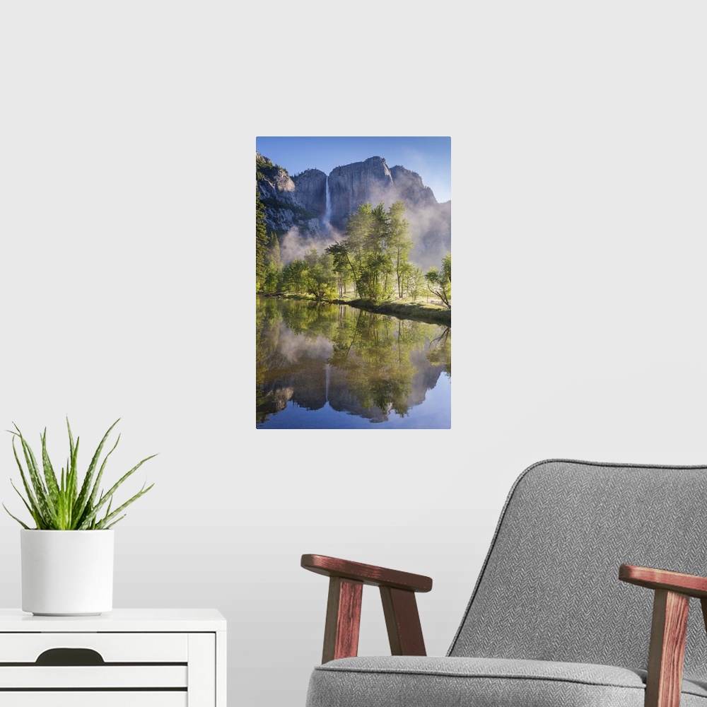A modern room featuring Yosemite Falls reflected in the Merced River at dawn, Yosemite National Park, California, USA. Sp...