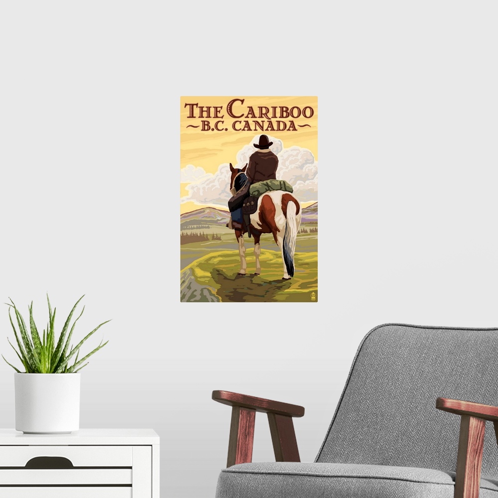 A modern room featuring Retro stylized art poster of a cowboy on horseback looking out over a rugged landscape.