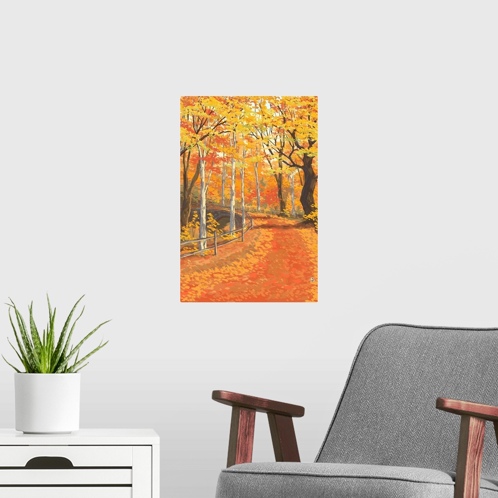A modern room featuring Retro stylized art poster of leaf covered road in a fall colored forest, with a fence running alo...