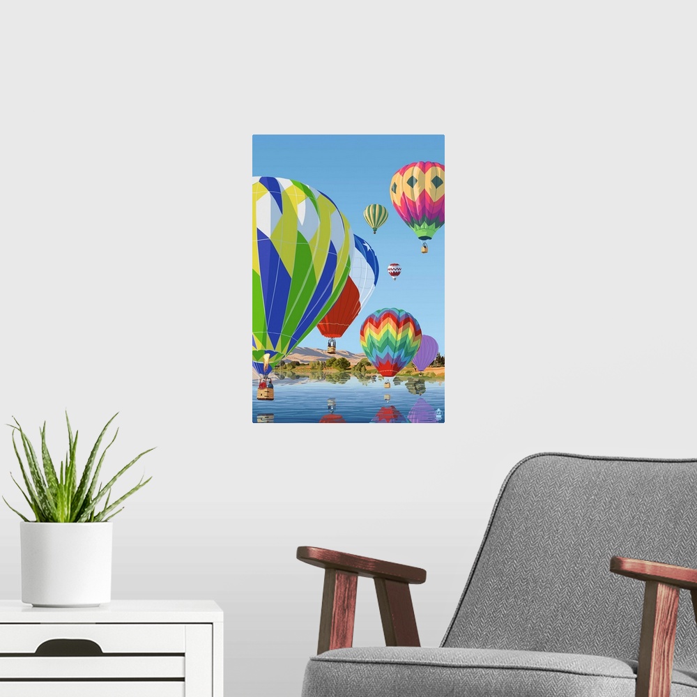A modern room featuring Retro stylized art poster of a fleet of hot air balloons over water.